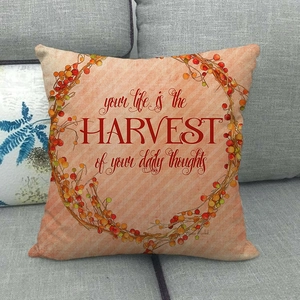 Detail of linen cushion cover with autumn harvest wreath and inspirational quote
