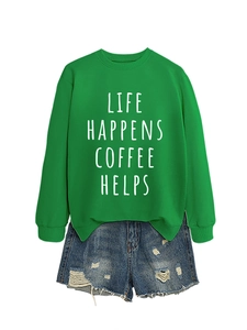 Close-up of bright green cotton sweatshirt with ribbed cuffs and printed lettering