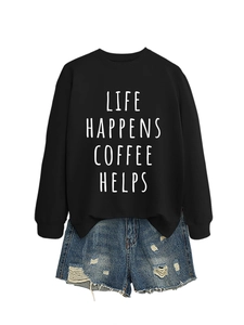 Flat lay of black crewneck sweatshirt with Life Happens Coffee Helps print and denim shorts