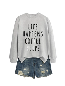 Detail of grey sweatshirt with 'Life Happens Coffee Helps' slogan and ripped denim shorts