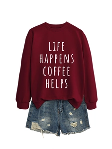 Detail of burgundy sweatshirt with white Life Happens Coffee Helps slogan and denim shorts