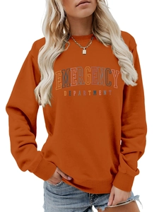 Detail of burnt orange sweatshirt with vintage rainbow Emergency Department print