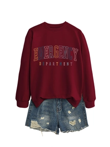 Flat lay of burgundy Emergency Department sweatshirt and distressed denim shorts
