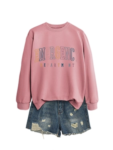 Flat lay of pink Emergency Department sweatshirt with distressed denim shorts on white