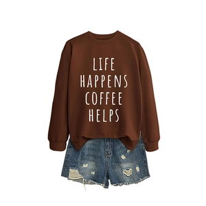 Brown Life Happens Coffee Helps sweatshirt paired with distressed denim shorts