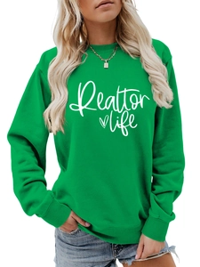 Detail of green Realtor Life sweatshirt showing soft ribbed cuffs and heart print