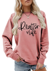 Detail of ribbed cuffs and Realtor Life print on pink crewneck sweatshirt for women