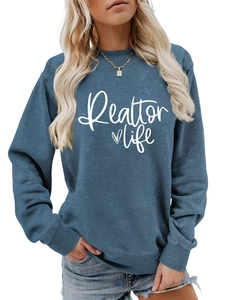Detail of Realtor Life print and ribbed cuffs on navy blue long sleeve sweatshirt