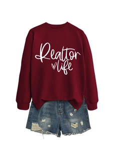 Detail of red Realtor Life sweatshirt with heart print and distressed denim shorts set