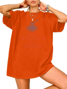 Detail of orange cotton t-shirt featuring more SPAGHETTI less UPSETTI graphic print