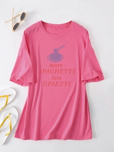 Flat lay of pink oversized t-shirt with funny spaghetti graphic and summer accessories