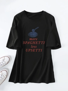 Flat lay of black cotton T-shirt featuring More Spaghetti Less Upsetti graphic and white shoes