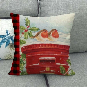 Close-up of Christmas robin birds on a red mailbox print with buffalo plaid accents
