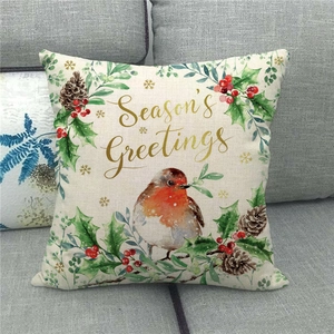 Détail de la housse de coussin en lin avec rouge-gorge, houx et motif Season's Greetings