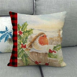 Detail of linen Christmas pillowcase showing watercolor robin and holly berry design