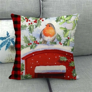 Detailed texture of linen cushion cover with watercolor Christmas bird and holly berries