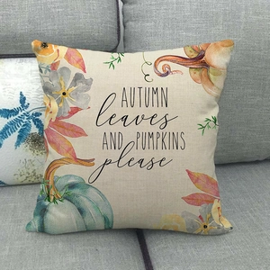 Detailed close-up of linen pillow cover with watercolor pumpkin and maple leaf patterns