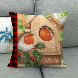 Detail of linen Christmas pillowcase featuring watercolor robin and red plaid border