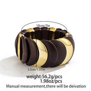 Detailed size and weight specs for the wide geometric stretch bracelet with gold accents