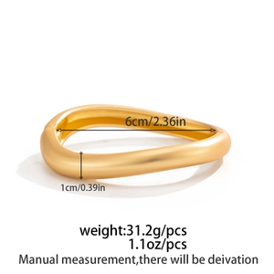 Detailed view of wide gold wavy textured bangle with dimensions and weight specs