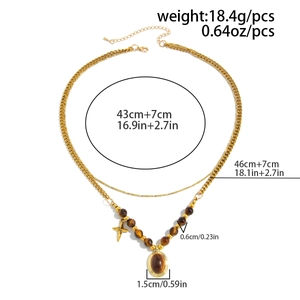 Detailed specs of double-layer vintage necklace with tiger eye stone and star charms