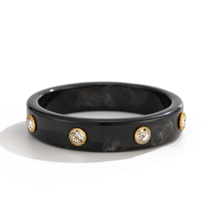 Bracciale in resina nera irregolare con pietre di zircone incastonate in oro