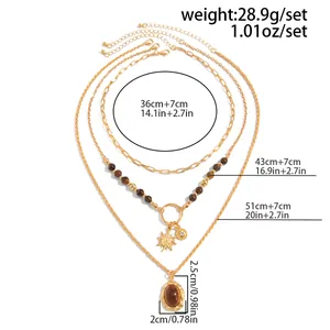 Detailed size chart for layered vintage necklace featuring tiger eye stone and solar pendant