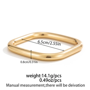 Close-up of golden square metal bangle showing dimensions of 6.5cm inner diameter