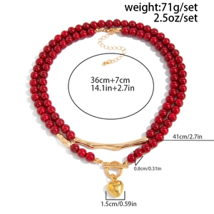 Detailed view of red acrylic beaded double-layer necklace with golden heart OT buckle toggle