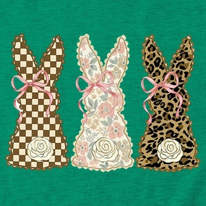 Detail of three bunny silhouettes with plaid, floral, and leopard prints on green fabric