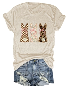 Flat lay of a beige t-shirt with three rabbit graphics in floral, plaid and leopard prints