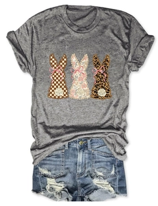 Detail of t-shirt with plaid floral leopard rabbits and distressed denim shorts