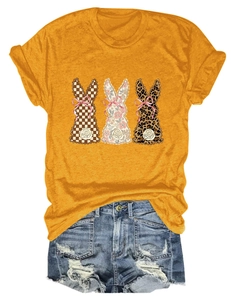 Detail of yellow cotton T-shirt featuring three rabbits with bows and denim shorts