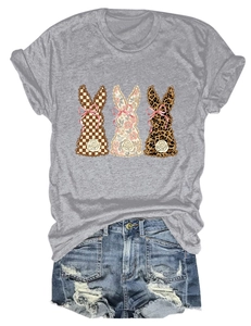 Detail of grey t-shirt featuring three bunny prints and distressed blue denim shorts