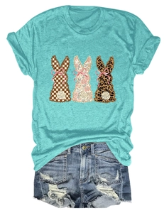 Close-up of green t-shirt with three cute bunnies in floral, plaid, and leopard prints