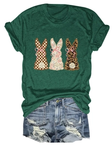 Detailed close-up of dark green t-shirt featuring three decorative rabbit prints
