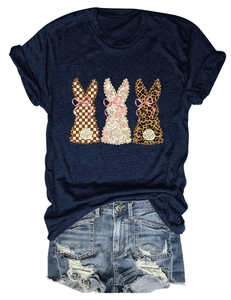 Close-up of rabbit silhouettes with plaid, floral and leopard print on navy t-shirt