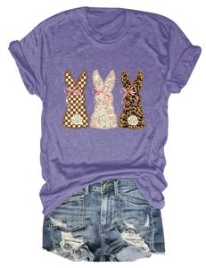 Detail of purple T-shirt featuring three bunny silhouettes in plaid, floral and leopard patterns