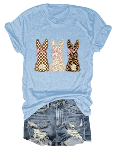 Detail of three vintage rabbits print with floral and leopard patterns on light blue t-shirt