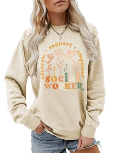 Detail of colorful floral social worker print on apricot crewneck sweatshirt fabric