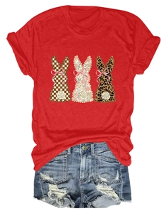 Detailed view of red t-shirt with three printed rabbits and distressed denim shorts