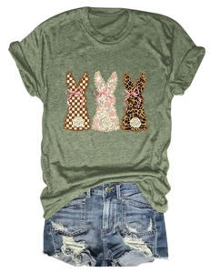 Detail of dark green t-shirt with plaid, floral and leopard print bunny graphics