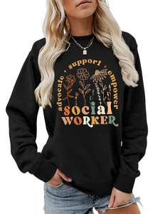 Detailed close-up of floral print and professional empowerment lettering on black hoodie