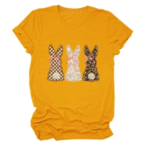 Detail of three decorative rabbits on a yellow t-shirt with floral and leopard textures