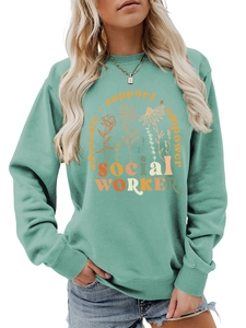 Close-up of advocate support empower text and floral graphics on a sage green sweatshirt
