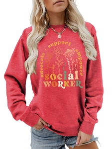 Close-up of ribbed cuffs and floral graphic print on dark red crewneck sweatshirt
