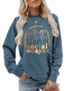 Close-up of advocate support empower text and floral print on dusty blue sweatshirt