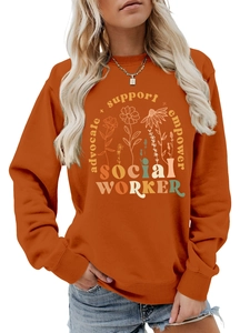 Detail of burnt orange sweatshirt showing social worker text and floral illustration