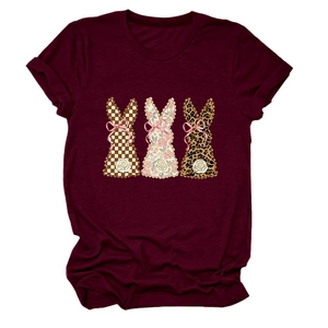 Detailed view of burgundy t-shirt with plaid, floral and leopard print rabbit silhouettes