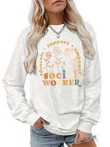 Detail of floral printed social worker sweatshirt with advocate support empower text